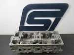 1989-90 Mitsubishi Mirage / Colt 1.5L 4G15 Cylinder Head (no Cam Rockers) Remanufactured. Price: $299.95.